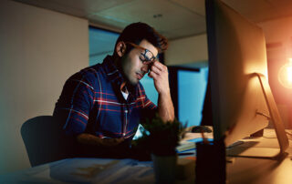 Man stressing over student loans.