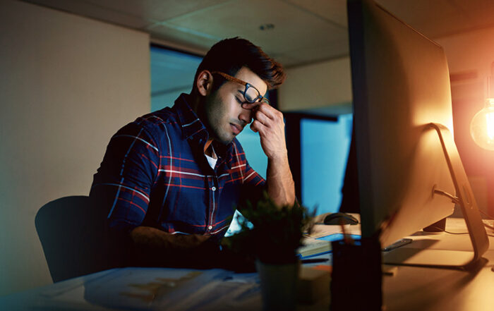 Man stressing over student loans.